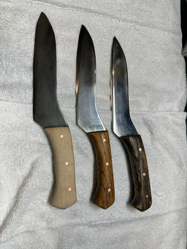 Three knives with wooden handles